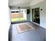 Enclosed porch with rug, view to the backyard, and access through sliding glass doors at 1361 Sterling Oaks Dr, Casselberry, FL 32707