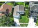 Charming single-Gathering home boasts lush lawn, landscaped garden, and two-car garage at 14130 Leicester Ln, Orlando, FL 32828
