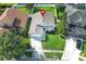 Charming single-Gathering home boasts lush lawn, landscaped garden, and two-car garage at 14130 Leicester Ln, Orlando, FL 32828