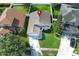 Charming single-Gathering home featuring a well-manicured lawn, mature trees, and a private driveway at 14130 Leicester Ln, Orlando, FL 32828