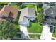 Charming single-Gathering home boasts lush lawn, landscaped garden, and two-car garage at 14130 Leicester Ln, Orlando, FL 32828