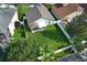 Expansive backyard with white vinyl fence and screened in patio at 14130 Leicester Ln, Orlando, FL 32828