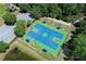Aerial shot of a well-kept basketball court with benches and green surroundings at 14130 Leicester Ln, Orlando, FL 32828