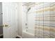 Bathroom featuring tub/shower with a decorative curtain and a modern shower head at 14130 Leicester Ln, Orlando, FL 32828