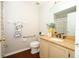 Cozy bathroom with a wood vanity and decorative accents at 14130 Leicester Ln, Orlando, FL 32828