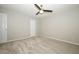 Comfortable bedroom features plush carpet, ceiling fan, and closet for ample storage at 14130 Leicester Ln, Orlando, FL 32828