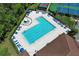 A luxurious community pool with ample lounge chairs and umbrellas, perfect for relaxation and leisure at 14130 Leicester Ln, Orlando, FL 32828
