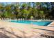 A spacious community pool featuring plenty of lounge chairs and a splash fountain for Gathering fun at 14130 Leicester Ln, Orlando, FL 32828
