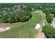 Expansive golf course with lush green fairways, sand bunkers, mature trees, and scenic water features at 14130 Leicester Ln, Orlando, FL 32828