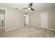 Spacious main bedroom with plush carpeting, ceiling fan, ensuite bathroom, and large closet at 14130 Leicester Ln, Orlando, FL 32828