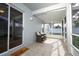 Inviting screened patio with tile flooring and comfortable seating area at 14130 Leicester Ln, Orlando, FL 32828
