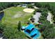 Aerial shot featuring a community playground with a shade canopy and playing fields at 14130 Leicester Ln, Orlando, FL 32828