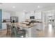 Modern kitchen with granite countertops, stainless steel appliances, and an island with bar seating, ideal for entertaining at 1419 Birwood St, Deltona, FL 32725