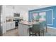 Modern kitchen featuring granite countertops, stainless steel appliances, and a central island with barstool seating at 1419 Birwood St, Deltona, FL 32725