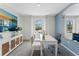 Bright office space with a large window, a sleek white desk, and modern decor, perfect for productivity at 1419 Birwood St, Deltona, FL 32725