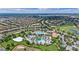 A lush Primary-planned community is shown from an aerial view, with a pool and community center at 1442 Moon Valley Dr, Davenport, FL 33896