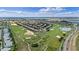 Expansive aerial view of the community showcasing the golf course and homes at 1442 Moon Valley Dr, Davenport, FL 33896