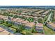 Aerial shot showcases a community with screened-in pools and well-maintained lawns, nestled in a cozy neighborhood at 1442 Moon Valley Dr, Davenport, FL 33896