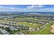 Community aerial showcasing golf course and neighborhoods with mature landscaping at 1442 Moon Valley Dr, Davenport, FL 33896