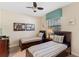 Bedroom with twin beds and wall decor for a creative living space at 1442 Moon Valley Dr, Davenport, FL 33896