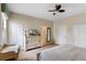 Spacious bedroom featuring a desk, closet, and a large dresser, creating a functional and inviting space at 1442 Moon Valley Dr, Davenport, FL 33896