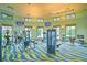 Bright community gym featuring exercise machines and multiple TVs at 1442 Moon Valley Dr, Davenport, FL 33896