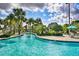 Take it easy in this lazy river surrounded by palm trees, lush tropical foliage, and poolside seating at 1442 Moon Valley Dr, Davenport, FL 33896