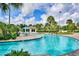 Enjoy this lovely community lazy river with poolside seating areas and lush tropical landscaping at 1442 Moon Valley Dr, Davenport, FL 33896