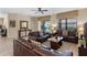 Warm living room featuring neutral paint, three sofas, and access to the pool area at 1442 Moon Valley Dr, Davenport, FL 33896