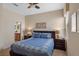 Comfortable main bedroom featuring neutral tones, ample lighting, and a full bathroom at 1442 Moon Valley Dr, Davenport, FL 33896