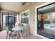 Relaxing screened patio with dining table, ceiling fan, and view of the pool and landscaped backyard at 1442 Moon Valley Dr, Davenport, FL 33896