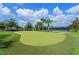 Beautiful putting green and tennis court in a well-maintained community at 1442 Moon Valley Dr, Davenport, FL 33896