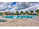 Relaxing pool area with lounge chairs and a poolside bar at 1442 Moon Valley Dr, Davenport, FL 33896
