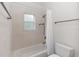 Bathroom featuring a shower/tub combo with tile surround and a coordinating vanity at 1908 S Farm Rd, Deland, FL 32720