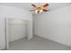 Bedroom with carpeted floor, closet and ceiling fan at 1908 S Farm Rd, Deland, FL 32720