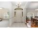 Bright foyer with tile flooring, a chandelier, and an arched doorway leading to other rooms at 1908 S Farm Rd, Deland, FL 32720