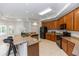 Spacious kitchen featuring custom wood cabinets, granite countertops, and stainless steel appliances at 1908 S Farm Rd, Deland, FL 32720