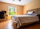 Cozy bedroom with a comfortable bed, natural light, and warm interior at 2006 Stone Abbey Blvd, Orlando, FL 32828