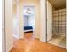 Hallway view leading to a bedroom with ceiling fan and an open bathroom at 2006 Stone Abbey Blvd, Orlando, FL 32828