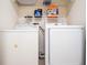 Functional laundry room with washer and dryer, providing convenience and efficiency at 2006 Stone Abbey Blvd, Orlando, FL 32828