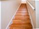Wooden staircase featuring wood steps and a handrail at 2006 Stone Abbey Blvd, Orlando, FL 32828