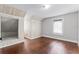 Bright bedroom featuring hardwood floors, neutral walls, natural light, and a unique built-in nook at 25 E Pinecrest Ave, Eustis, FL 32726
