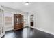 Dining area featuring refinished floors, vintage hutch, lots of light and access to kitchen at 25 E Pinecrest Ave, Eustis, FL 32726