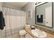 Bathroom includes a white and gray shower curtain, and a single vanity sink at 2550 Alafaya Trl # 9303, Orlando, FL 32826
