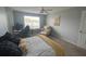 A bedroom featuring a bed, desk, chair, and a comfortable sitting area at 2550 Alafaya Trl # 9303, Orlando, FL 32826