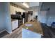 Compact kitchen featuring granite countertops, stainless steel appliances, and ample storage at 2550 Alafaya Trl # 9303, Orlando, FL 32826