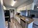 The spacious kitchen offers granite counters, stainless appliances, and ample cabinet space at 2550 Alafaya Trl # 9303, Orlando, FL 32826