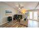 Cozy living room features a fireplace, and a walkout to the lanai at 2550 Alafaya Trl # 9303, Orlando, FL 32826