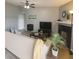 Comfortable living room features a fireplace, ceiling fan and light gray walls at 2550 Alafaya Trl # 9303, Orlando, FL 32826