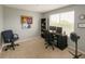 Office space featuring a desk, chair, bookcase, and a window with natural light at 2550 Alafaya Trl # 9303, Orlando, FL 32826